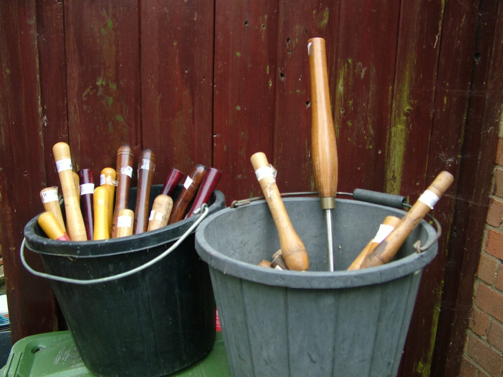 Two buckets of woodturning gouges